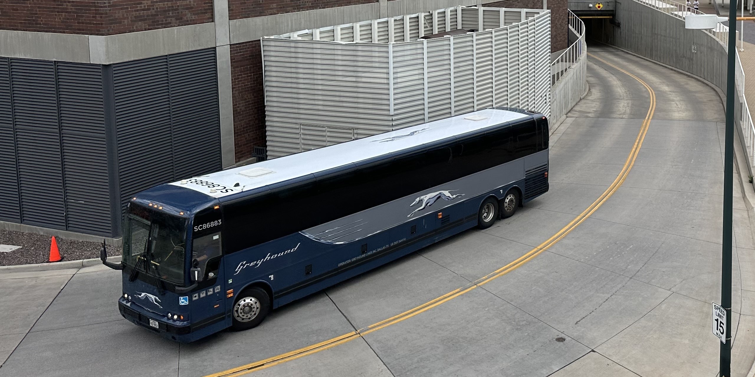 A Greyhound bus leaving Denver Union Station by the Northwest ramp.